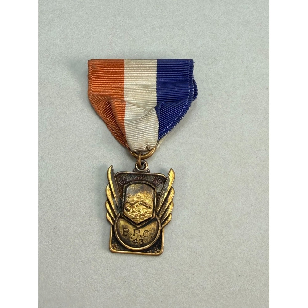 Vintage B.P.C. 43 Swimming Medal Orange White Blue Ribbon Winged Sports Award